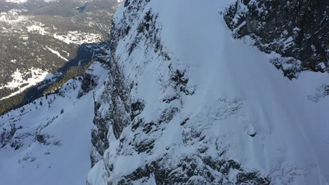 impressive snowy cliff in the coast mountains of bc, canada