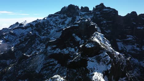 Smooth-drone-shot-of-the-black-and-white-peaks-of-the-mountain-Pico-Ruivo-in-Madeira