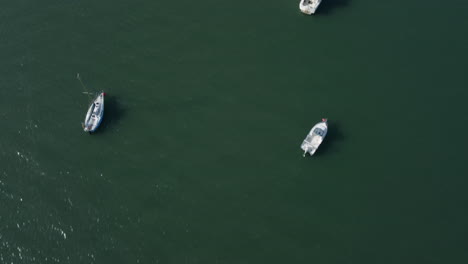 Topdown-Of-Ships-Navigate-On-Calm-River-At-Daytime