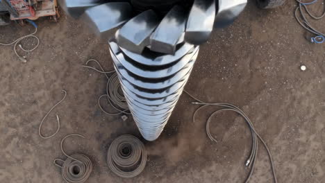 overhead view of a large industrial drill bit on a worksite