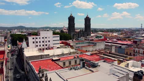 aerial of puebla cathedral and surrounding buildings on sunny day - puebla city, mexico