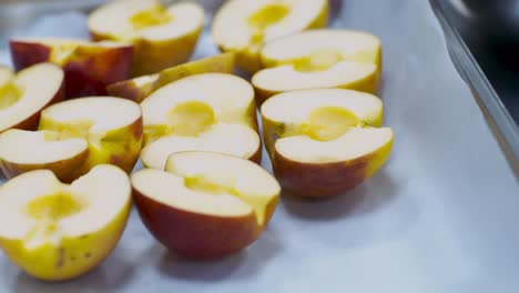 sliced apples on a baking sheet