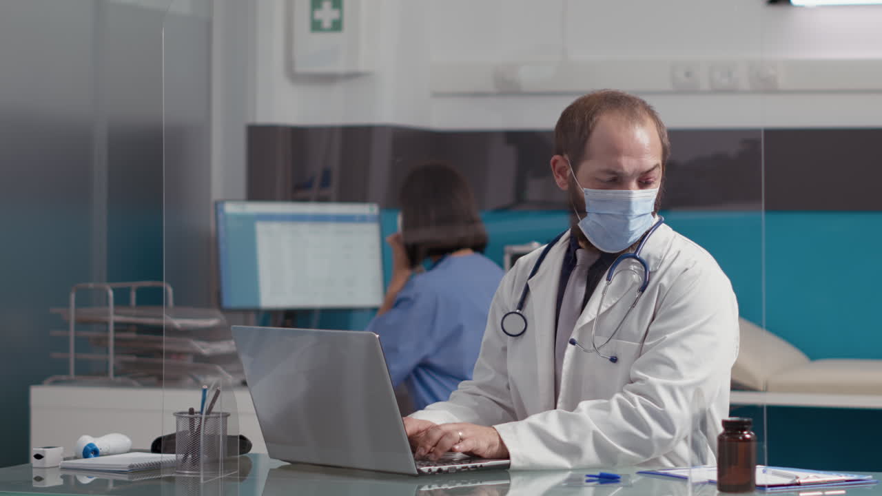 Health specialist using laptop computer to plan appointments