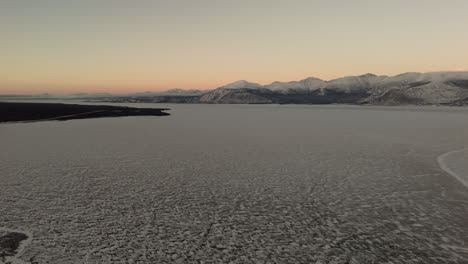 winter landscape on destruction bay at sunset in kluane national park, yukon canada. aerial drone shot