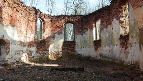 abandoned church interior wall remains with arch shape wall and without roof