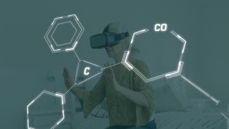 animation of chemical equations over caucasian woman using vr headset