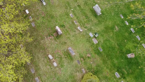 cemetery graveyard drone aerial footage grand rapids michigan with green foliage and trees and gravestones