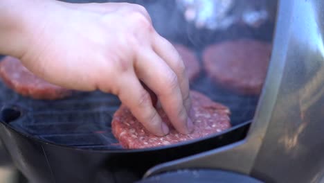 cooking burger meat patties on barbie - outdoor bbq barbecue