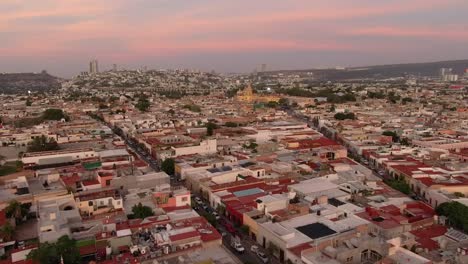 drone flight from plaza de armas towards plaza de los fundadores in santiago de querétaro, mexico - aerial shot