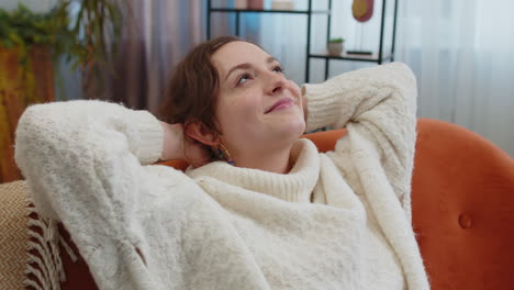 tired lazy woman enjoy relaxing on home sofa resting napping after hard working day, closed her eyes