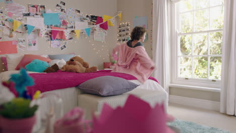 cute-little-girl-dancing-in-bedroom-looking-out-window-having-fun-enjoying-weekend-morning-at-home-doing-funny-dance-moves-wearing-pajamas