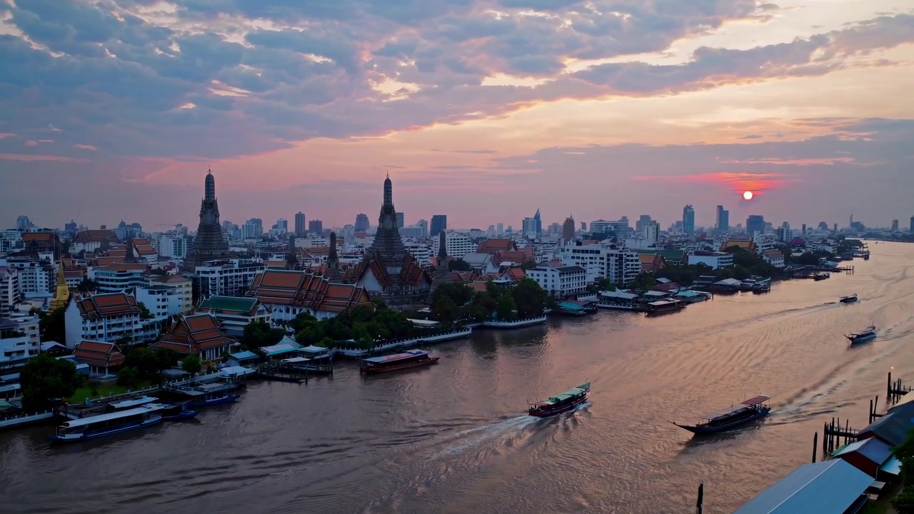 Aerial View of Wat Arun and Chao Phraya River at Sunset in Bangkok