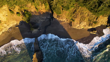 drone flying the ocean towards the beach and cliffs