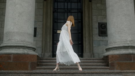 woman dancing in front of a building