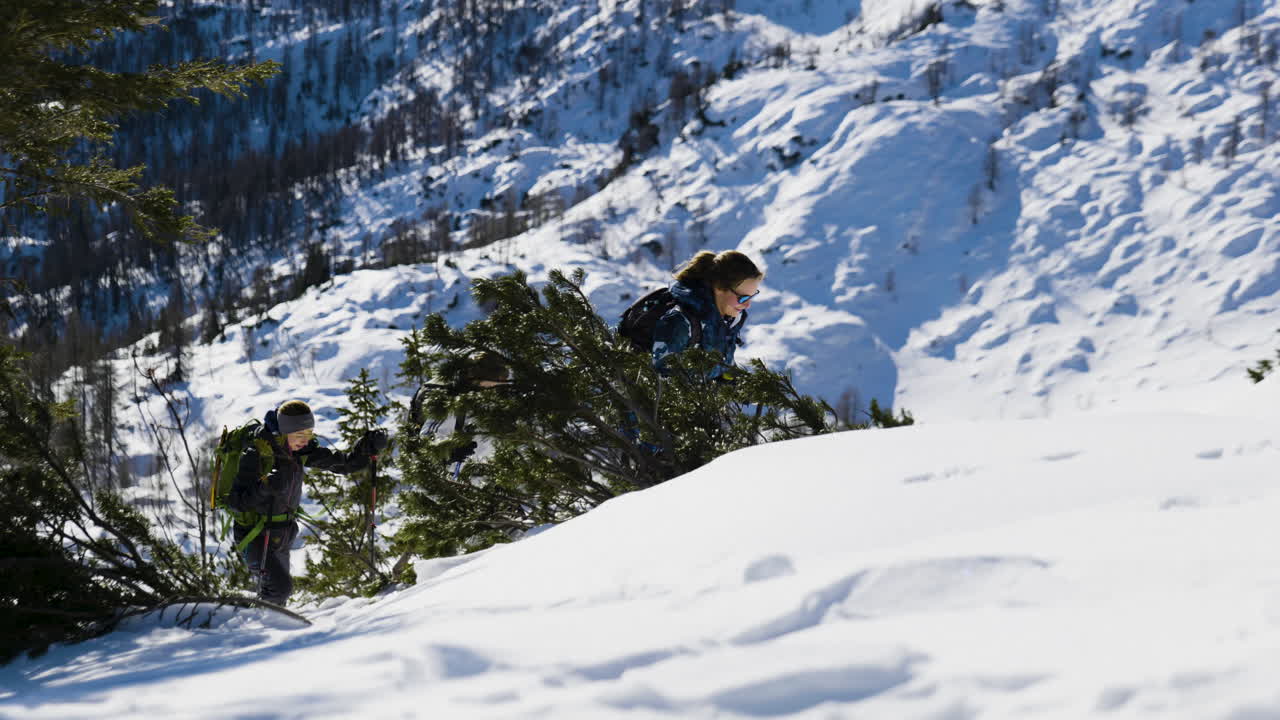 Hikers in Snowy Mountains