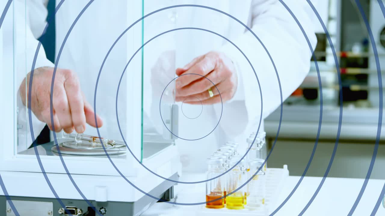 Senior scientist opening shield, moving vials, securing flask for assay, overlaying frames