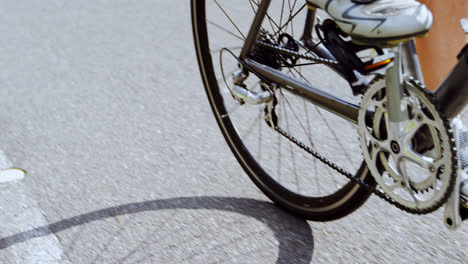 senior cyclist cycling on a road at countryside 4k