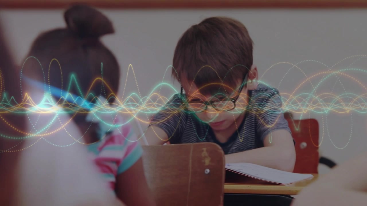 Waveform animation moving initiating camera panning, highlighting students writing notes in class