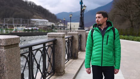 man walking in a mountain city park