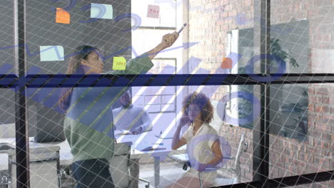data processing on interface over diverse female colleagues brainstorming in office