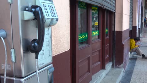 a public telephone along the street in havana cuba