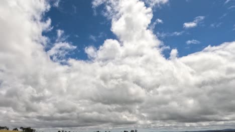 fast-moving clouds over a serene landscape