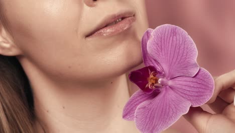 woman with orchid flower