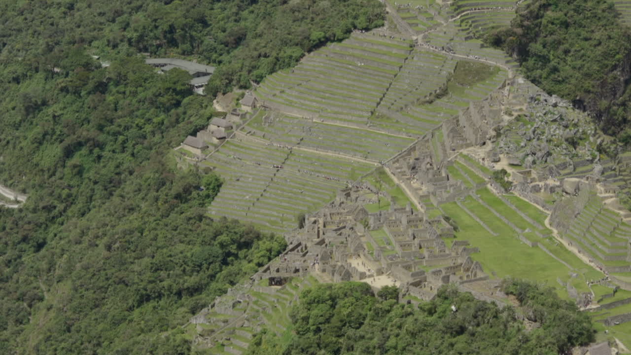 Aerial zoom to Machu Picchu Lost City, drone shot. Wide shot, panorama, scenic, landscape, establishing
