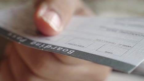 person holding a boarding pass