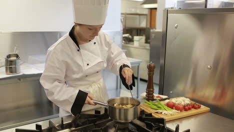 cook preparing a soup in a kitchen