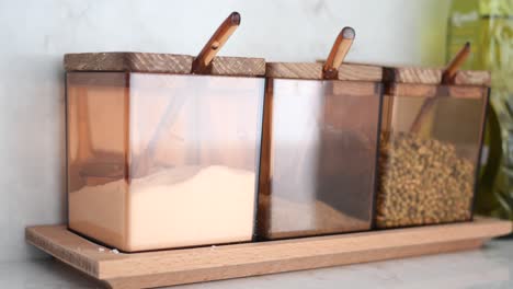 wooden spice jars on a tray