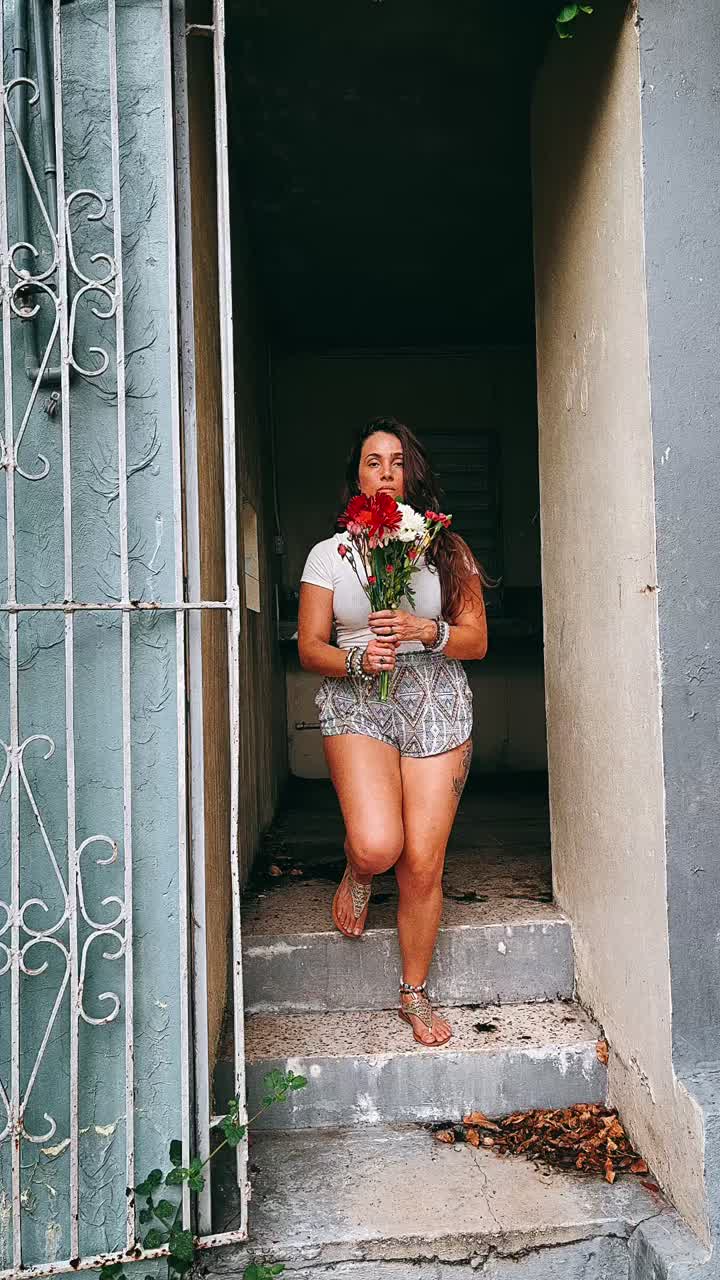 Woman with Flowers in Urban Setting