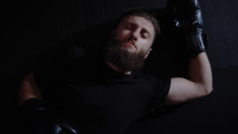 man lying down after a boxing match