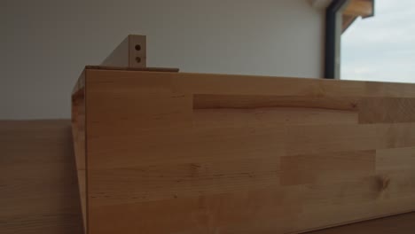 assembling diy furniture in a minimal modern spacious room 4k