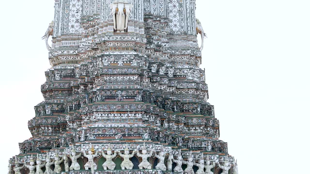 Close-up view of Wat Arun's ornate spire showcasing detailed craftsmanship and decorative elements.