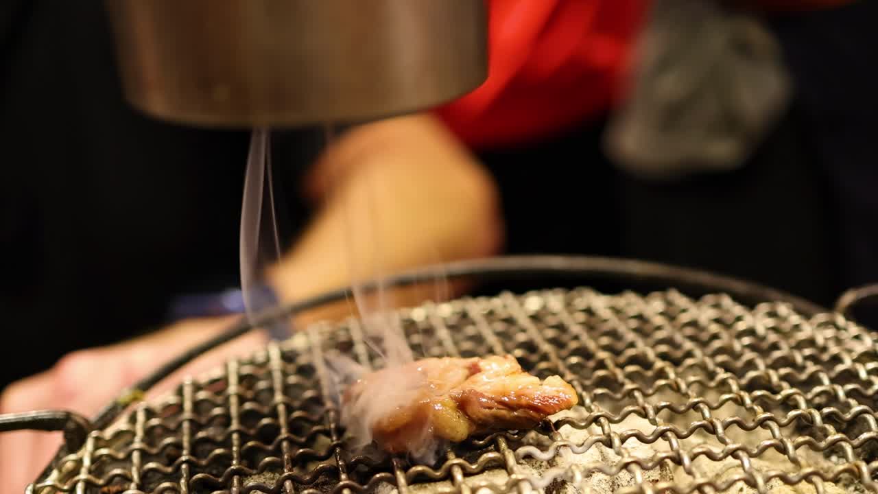 Showcasing a grill's smoke suction feature