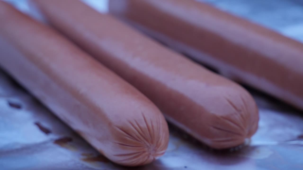 barbecue hotdog sausage grill outdoor in the summer late after