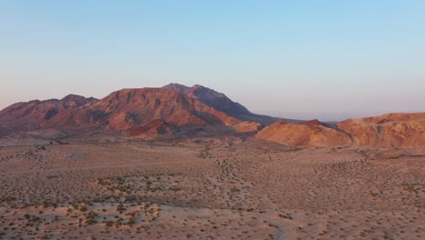 Orange-desert-mountain,-and-blue-skies,-from-a-salt-lake-desert-at-mexicali-Baja-California-mexico