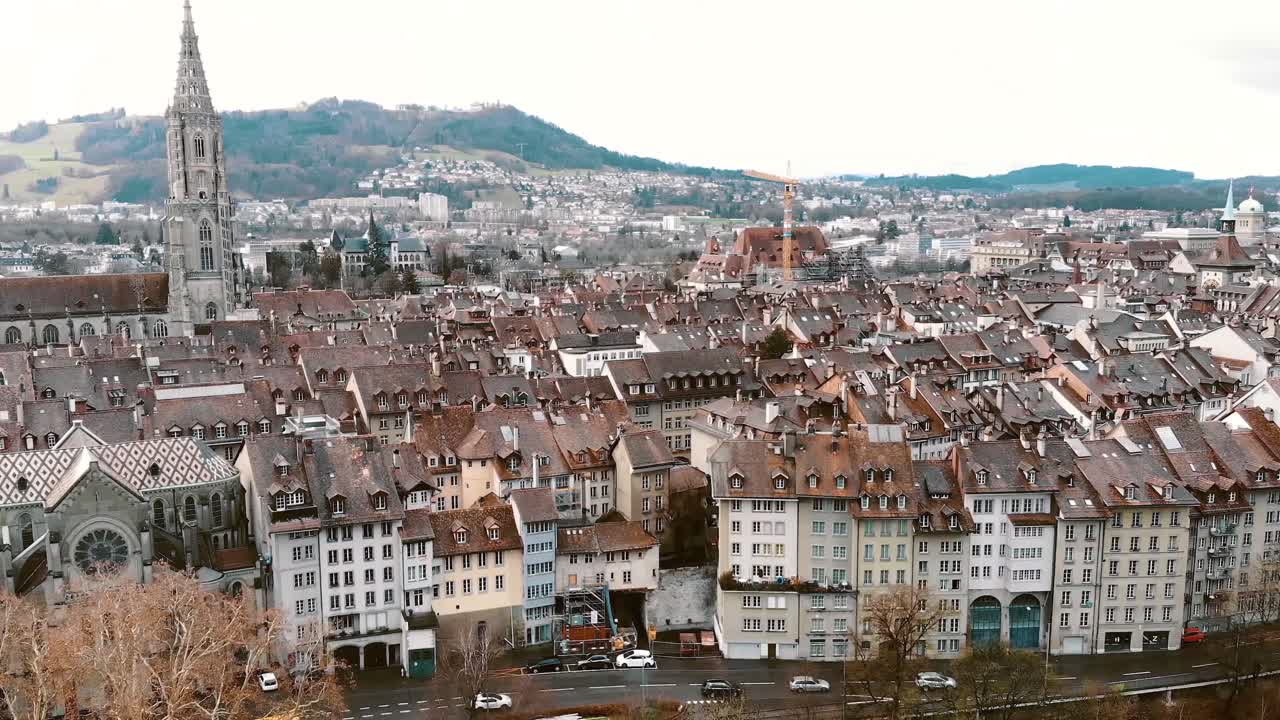 Aerial slide Pan over Cathedral of Bern and City Center, Switzerland