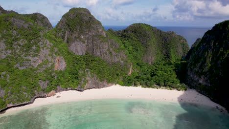 aerial drone video of phi phi leh with maya bay and pileh lagoon, krabi province, thailand. aerial top view of amazing tropical island with turquoise water and white beach, famous travel destination.