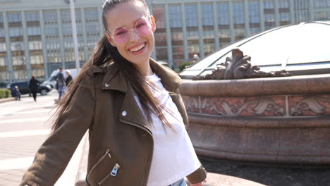 young woman smiling outdoors