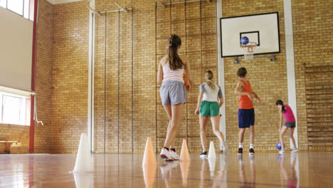 group of high school kids playing basketball