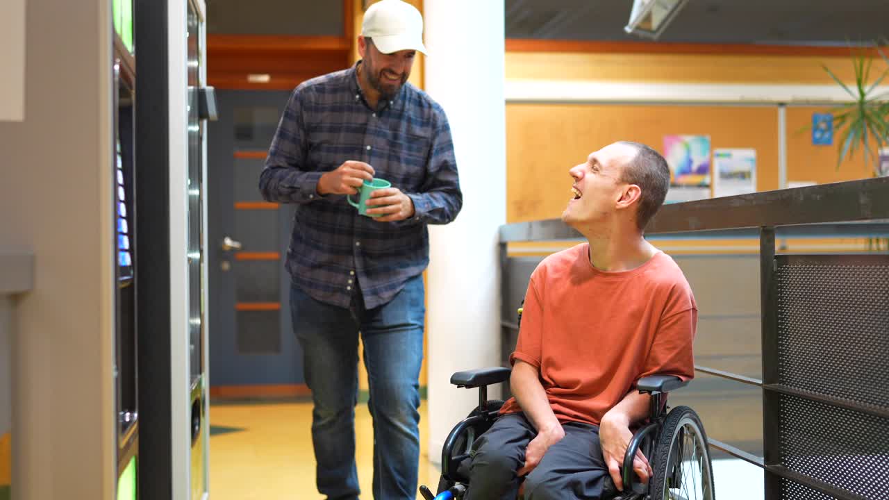 Friendship and Inclusion: Man in Wheelchair with Friend Getting Coffee