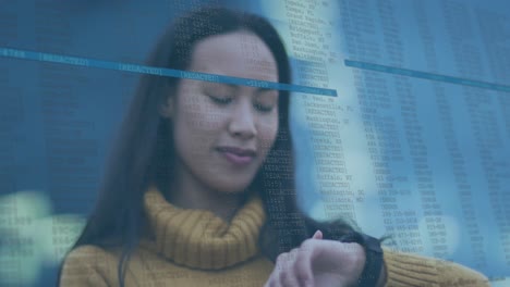 animation of data processing over biracial woman using smartwatch