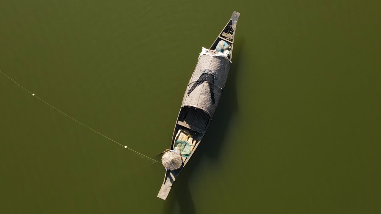 fisher man Net fishing in river of Surma, Bangladesh, aerial top down view