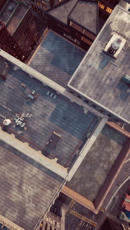 aerial view of city rooftops at sunset