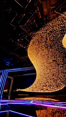 dynamic golden light sculptures and neon stage