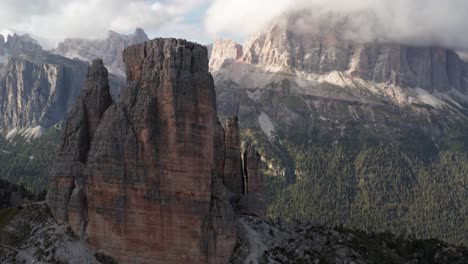 cinque torri mountain rock formation in dolomites, aerial close up orbit