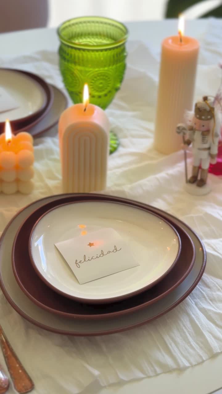 Festive Table Setting with Lit Candles and Place Card