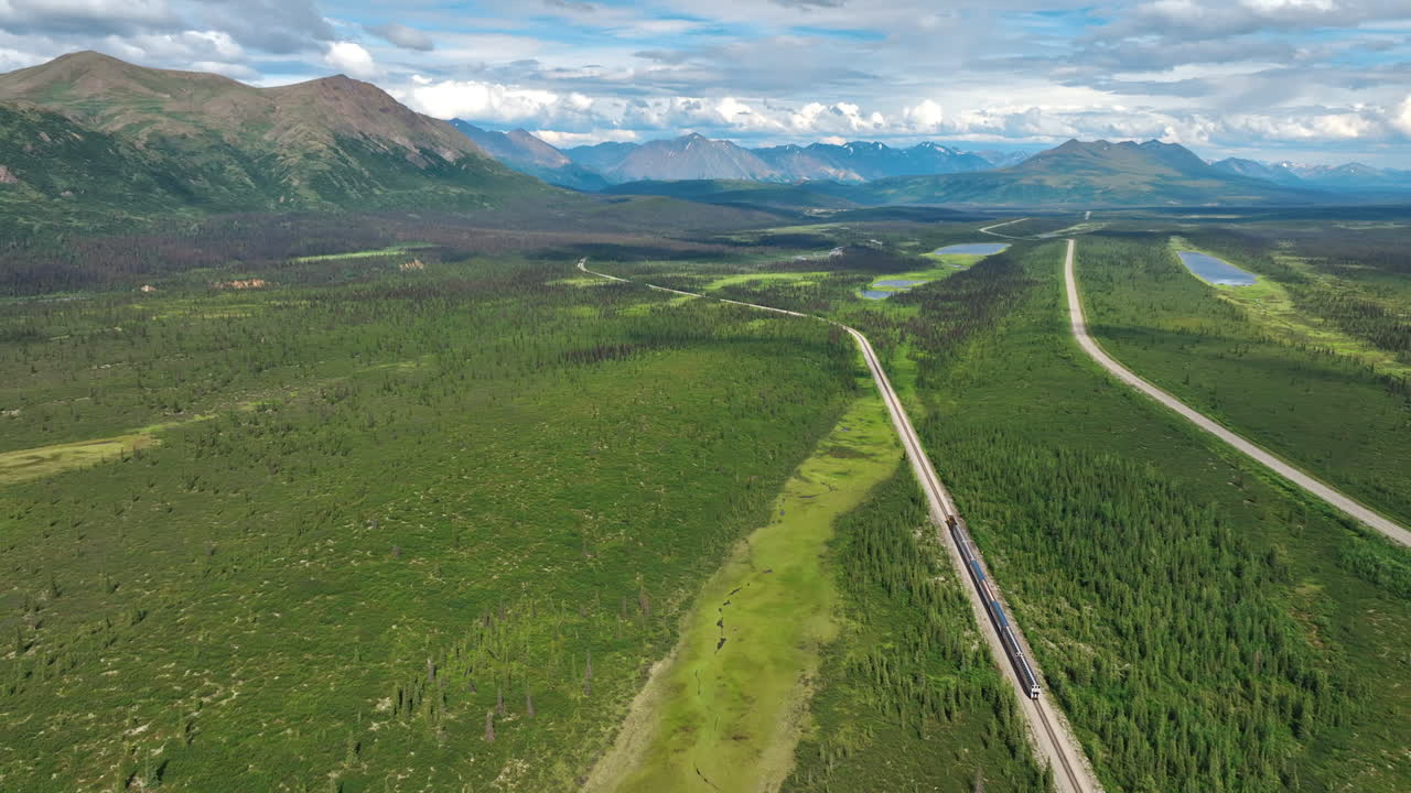 Exploring the vast landscapes of Alaska. Endless greenery and winding roads create a breathtaking view in the remote wilderness of Alaska during summer